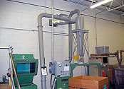 Cyclone separator collects plastic grinding dust.