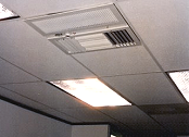 Above-ceiling air cleaner removes odor from break room.