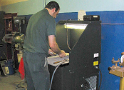 Downdraft table collects steel grinding dust.