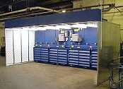 Containment booth for fiberglass dust.