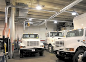 Hose drops for diesel truck exhaust in training school.