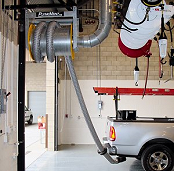 Hose reel for exhaust removal from city vehicle repair shop.